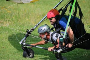 enock and pilot in hang glider ready for takeof